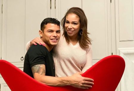 Thiago Silva and his wife Isabelle Silva pose for a picture.